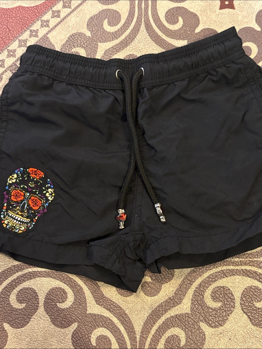 Kids Black Swim Trunks with Colorful Skull Accent